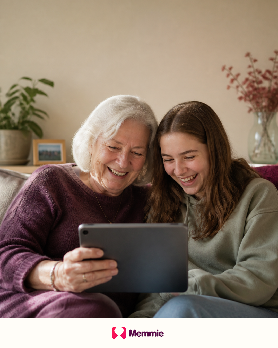 A grandmother and granddaughter enjoying family photographs on a tablet.