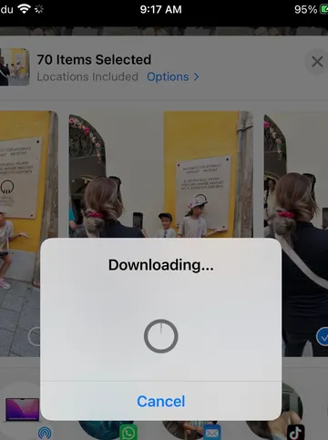A phone photo library stuck while downloading 70 selected items