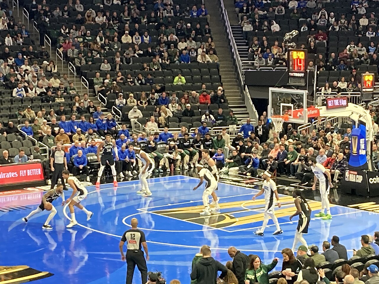 Basketball players in game action