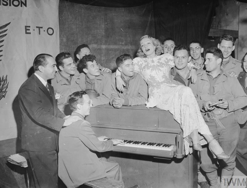 Entertains Allied troops