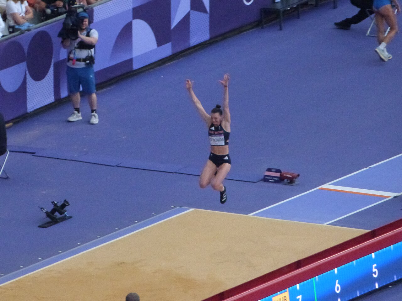 Athlete in flight during the Olympic long jump