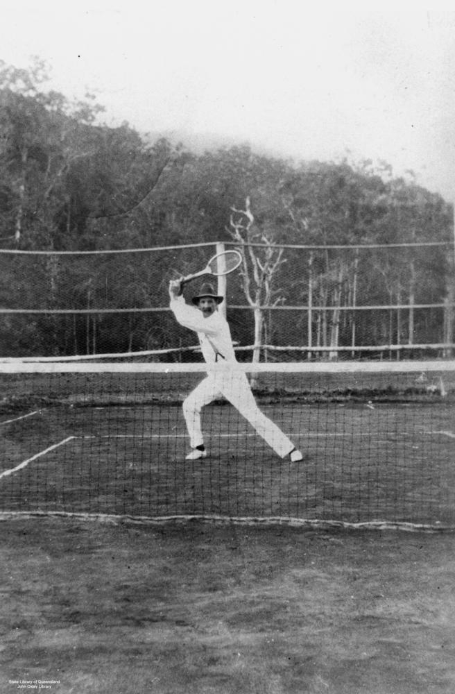 Tennis player striking the ball during a match