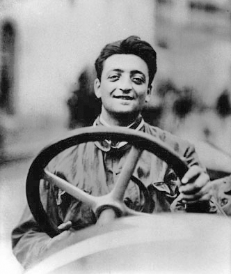 Sees his first motor race